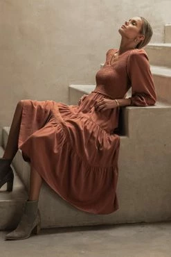 LUMIERE Smocked Tiered Midi Dress In Rust Dresses