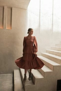 LUMIERE Smocked Tiered Midi Dress In Rust Dresses